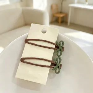 Cute bow hair clips set, brown and green bb clips for side bangs and sweet everyday styling.
