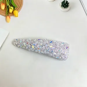 Sparkling crystal hair clip detail, shimmering rhinestone barrette for stylish women and daily wear.