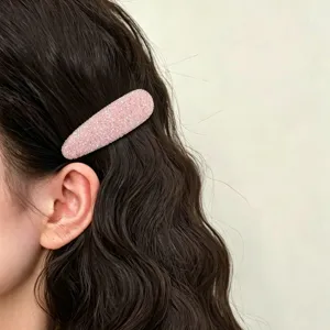 Pink glitter BB hair clip detail close-up, perfect for styling side bangs and loose hair.