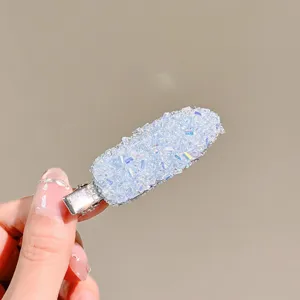 Close-up detail of the sparkling crystal ice lolly hair clip showing brilliant rhinestone shine.