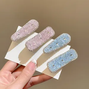 Close-up detail of sparkling crystal rhinestone hair clips, dopamine fashion hair accessory.