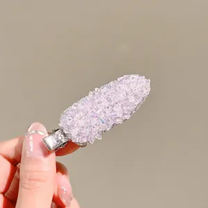 Exquisite pink crystal hair clip detail shot, sparkling rhinestone side clip for women.