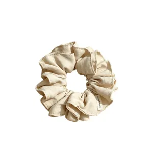 Beige fabric hair scrunchie with ruffled design, soft elastic hair tie for women and girls daily wear