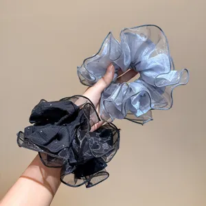 Close-up detail of Korean style large sheer organza hair scrunchie with fine sparkle design.