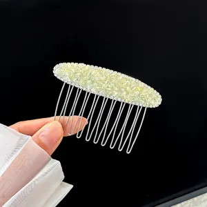 Exquisite rhinestone insert comb detail, sparkling green crystal hair accessory for elegant hairstyles.