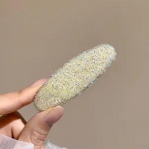Sparkling rhinestone hair clip detail view, crystal side clip shiny close-up display