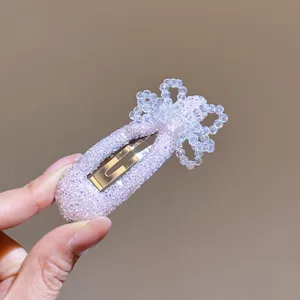 Korean crystal bow hair clip detail shot, sparkly rhinestone BB hairpin for daily hair styling.