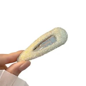 Shimmering rhinestone teardrop snap hair clip for stylish side bangs and daily hairstyles.