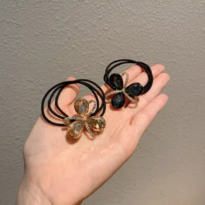 Chic rhinestone clover hair ties set, high elasticity multi-strand ponytail holder detail.