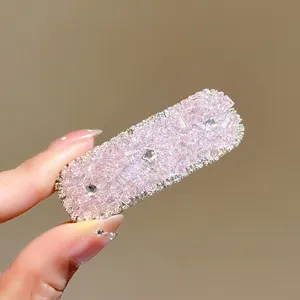 Pink rhinestone crystal side hair clip detail view, sparkling cute hair accessory for women.