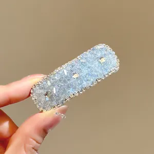 Sparkling crystal rhinestone hair clip for women, stylish side hairpin and shiny hair accessory.