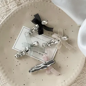 Detailed shot of rhinestone bow hair clips, elegant side clip and bangs pin for women.