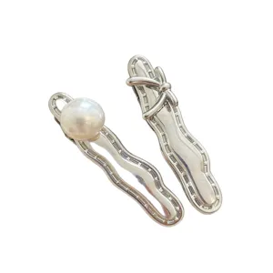 Silver metal hair clips set with elegant pearl and bow design for women daily hair styling.