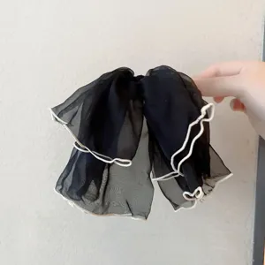 Black chiffon hair bow detail, lightweight sheer fabric with white lettuce edge trim for daily wear.