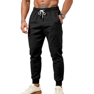 Pantaloni da jogging neri da uomo con coulisse in vita, tasche con zip e inserti stilosi.