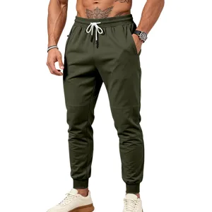Pantaloni da jogging verdi militari da uomo con coulisse, vita elastica e tasche con zip.