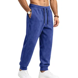 Detail view of men blue suede sweatpants, comfortable elastic waist drawstring design.