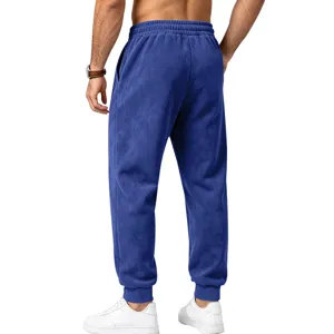 Men's blue suede jogger sweatpants with elastic waist and cuffed hem, comfortable fit.