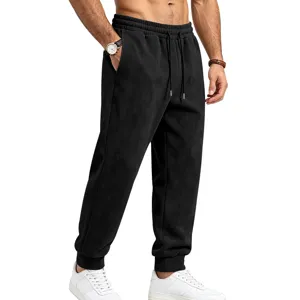 Men's black suede fleece joggers with elastic drawstring waist and cuffed ankles for casual wear.