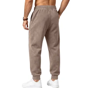 Back view of men's brown suede fleece jogger pants, featuring elastic waist and cuffed hem.