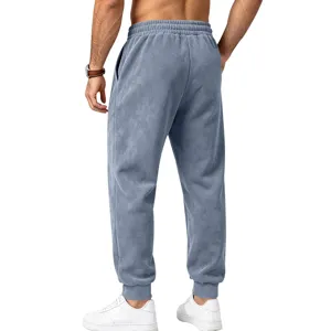 Close-up detail of mens fleece jogger sweatpants back view, soft suede texture fabric.