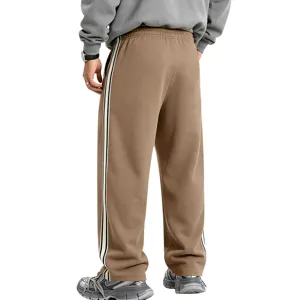 Detail view of men's fleece-lined side stripe wide leg sweatpants, heavyweight knit.