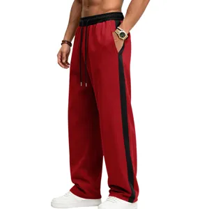 Detail view of men's fleece-lined wide-leg sweatpants featuring stylish contrast side stripes.