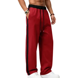 Red fleece wide-leg sweatpants with black side stripe, casual knit athletic pants detail.
