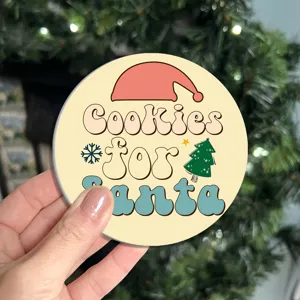 Christmas round car coaster with cute Santa hat and retro typography holiday design.