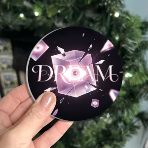 Circular silicone drink coaster with artistic surreal cube and eye design for home coffee decor.