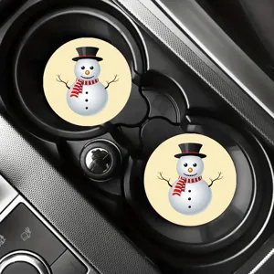 Close-up detail view of cute cartoon snowman silicone car cup coasters in vehicle holder.