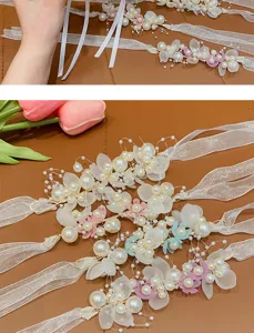 Exquisite pearl flower hairband details, featuring white ribbon and delicate petals for kids.