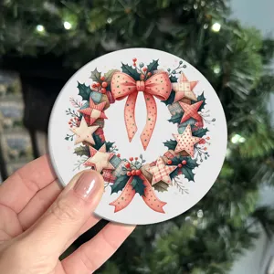 Christmas wreath silicone coaster detail shot, festive heat resistant cup mat for home table.