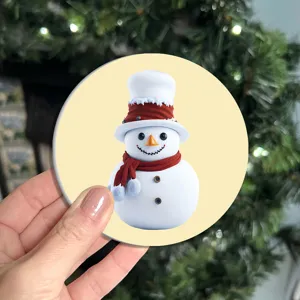 Detailed close-up of a cute cartoon snowman silicone coaster with a festive red hat and scarf.