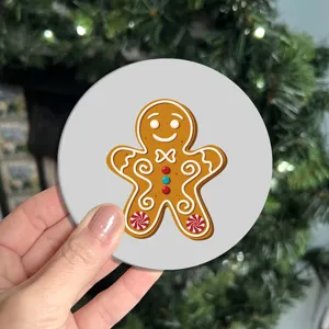 Cute Christmas gingerbread man round car coaster detail view, non-slip rubber cup mat for table.
