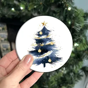 Round car coaster with abstract blue gold Christmas tree watercolor art design detail.