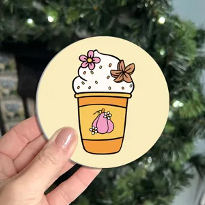 Round cup coaster detail close-up showcasing cute coffee cup illustration and heat resistant material.