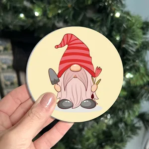 Cute cartoon gnome silicone coaster with festive design, perfect for home and table decor.