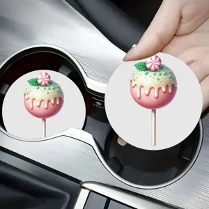 Sous-verre de voiture en céramique absorbante avec joli design de sucette rose et dessert.