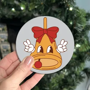 Retro cartoon bell soft rubber coaster with cute vintage design for table decor and protection.