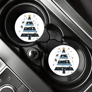 Detail view of round Christmas tree pattern car cup coasters placed in vehicle holder.