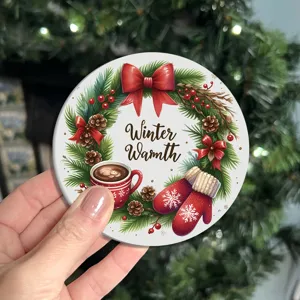 Christmas festive holiday round coaster close up detail featuring cute winter wreath and cocoa cup.