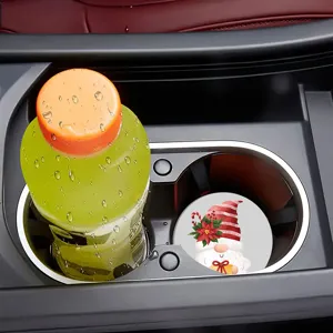 Detail view of Christmas diamond painting coaster inside car cup holder, festive decor.