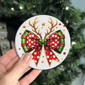 Detailed view of the round Christmas silicone coaster featuring festive bow and reindeer antlers.