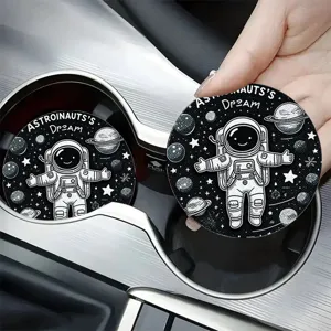 Car cup coaster detail showing astronaut pattern and non-slip surface in vehicle cup holder.
