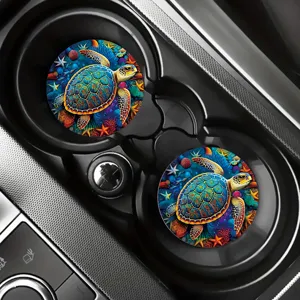 Detailed view of colorful sea turtle silicone car coasters placed in center console cup holders.
