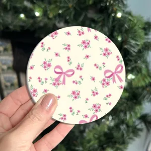 Pink floral silicone coaster with cute bow design, heat resistant and anti-slip cup mat.