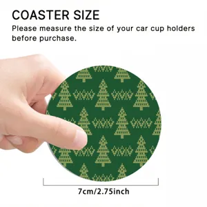 Close-up of a round car cup holder coaster featuring a festive green knit Christmas tree pattern.