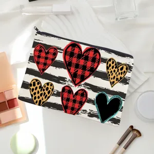 Canvas makeup pouch with cute heart prints, portable zipper cosmetic bag for daily use.