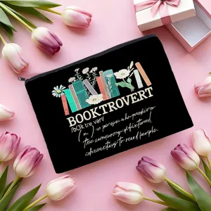 Détail de trousse de maquillage en toile noire avec design littéraire et tulipes roses.